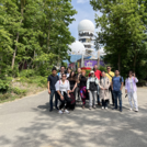 group of researchers in front of Teufelsberg buildings