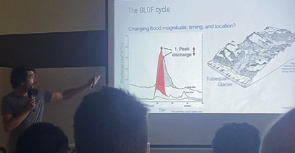 Georg speaking about ice-dammed lake outburst floods at the Penrose conference (Photo: N. Lützow)