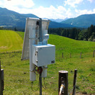 Field site Achele: CRNS sensor with solar panels installed at a green pasture in a pre-alpine landscape | Photo: Cosmic Sense Consortium
