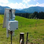 Field site Achele: CRNS sensor with solar panels installed at a green pasture in a pre-alpine landscape | Photo: Cosmic Sense Consortium