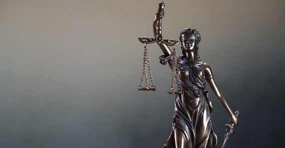 The Statue of Justice or lady justice. The photo is from AdobeStock/Aerial Mike.