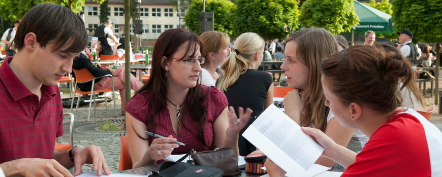 Students sitting at a table talkting