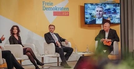 Sabine Kuhlmann at panel discussion with Christian Lindner