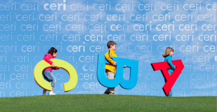 Children with letters under their arm run across the lawn