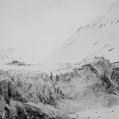 Snowmobiles in front of the surging Vallakbreen glacier