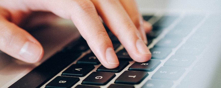 Human hands on laptop