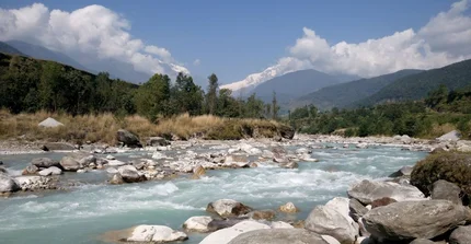 River gravel of the Seti, Nepal. In the background the Annapurna Massif