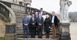 Group of people standing on stairs for a photo