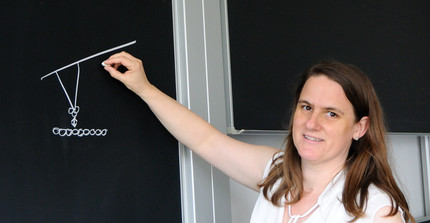 Mrs. Prof. Hoffmann-Vogel in front of the blackboard