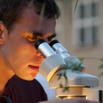 Student working with microscope