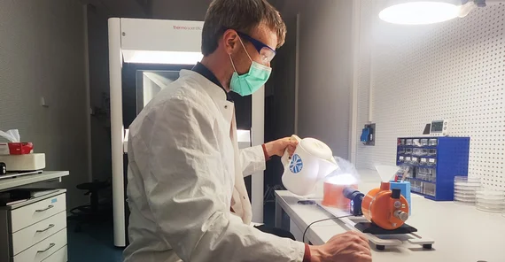 Man transferring the samples to the sample holder.