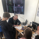 Michael Lenhard signing certificates for children