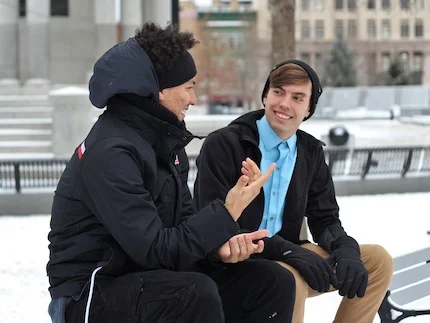 Two friends talking outside