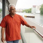 Portrait picture of Satish Poduval by a river