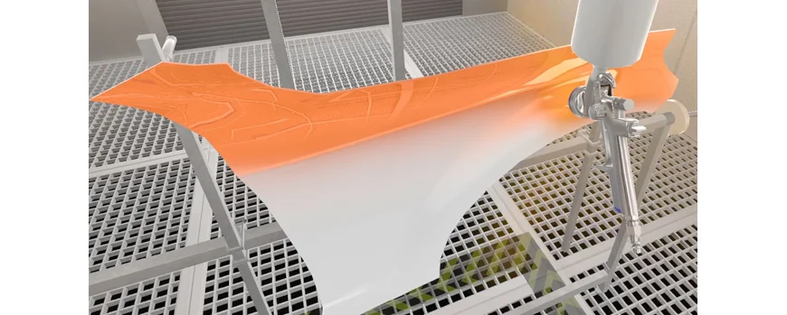 Eine virtuelle Lernumgebung: Ein Fahrzeugteil wird mit einer Lackierpistole mit orangener Farbe besprüht.