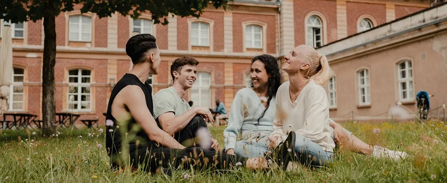 UP students sitting in grass