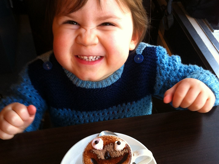 small child in front of a muffin