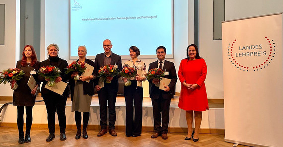 A group of people at an award ceremony