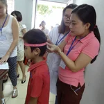Measuring head circumference at the hospital visit