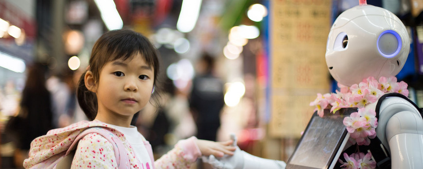 Robot holding hands with child