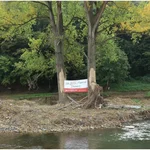 Ahrweiler – Walporzheim, 11/10/2021: Sign on trees marked by the flood: "We AHR familiy: Danke!"