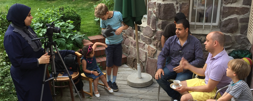 Safa'a interviewing refugees in a garden