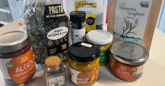 Food products with added algae including bread spreads and pasta.