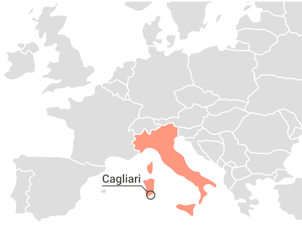 Detail of a map of Europe with the mark where exactly the city of Cagliari is located.