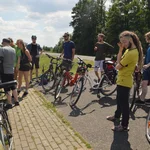 Bicycle Tour. At the Odra river, the group listening to Hubert Wiggerings explanations