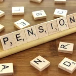 scrabble letters forming the word pension