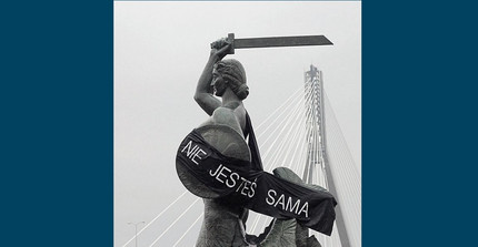 “You are not alone” sign on the Mermaid of Warsaw