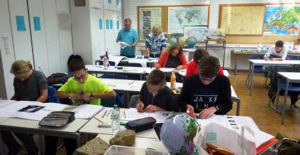 Pupils and teacher in classroom