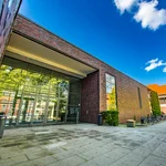 Large entrance portal of a building made of red clinker bricks