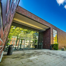 Large entrance portal of a building made of red clinker bricks