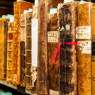 This image shows a row of books in Hebrew in a shelf at the University Library.