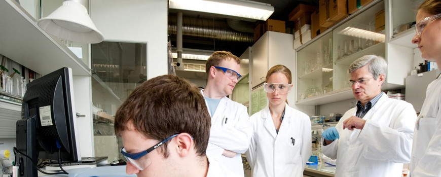 Dr Mickler with students in a lab