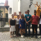 Kulak group in front of a yellow deer sculpture