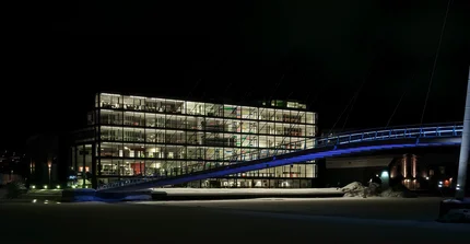 University building and bridge in the night