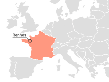 Detail of a map of Europe with the mark where the city of Rennes is located.