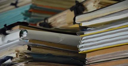 The picture shows a stack of books.