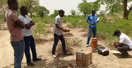 The PhD student from Ghana is demonstrating how to measure GHG