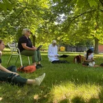 Katrina Schlunke teaches a seminar on the lawn of the University of Potsdam