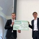 Prof. Dr. Neitzel hands the scholarship cheque to Mr. Julian Howe who has been awarded this year’s scholarship of the Association of Friends of the Chair of War Studies at the University of Potsdam.