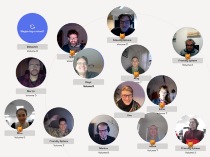 Screenshot of 14 smiling people in a video conference