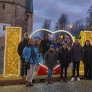 Kulak group in front of a light installation "I love Magdeburg"