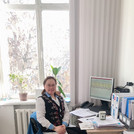 Baiansuluu Terbishalieva at her desk in the office