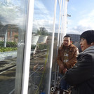 Ifrad and Emilia looking at the grown plants