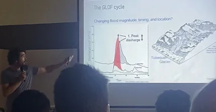 Georg speaking about ice-dammed lake outburst floods at the Penrose conference (Photo: N. Lützow)