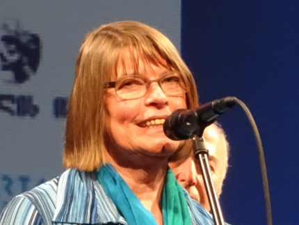 Susanne Ziegler behind a microphone
