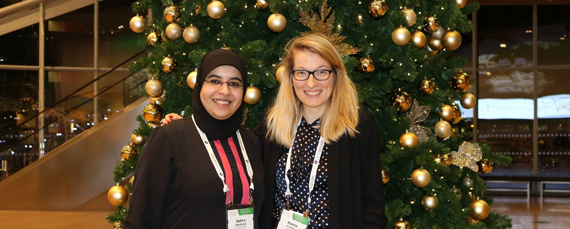 Safa'a and Hanna in front of a christmas tree